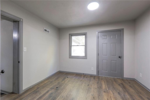 entryway with dark hardwood / wood-style floors