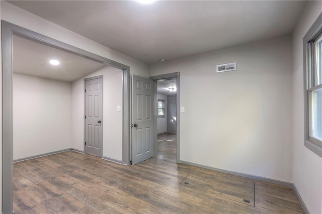 spare room featuring dark hardwood / wood-style floors