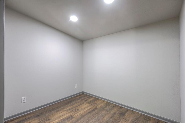 unfurnished room featuring dark hardwood / wood-style floors