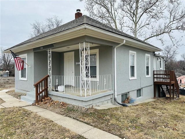 view of property exterior featuring a porch