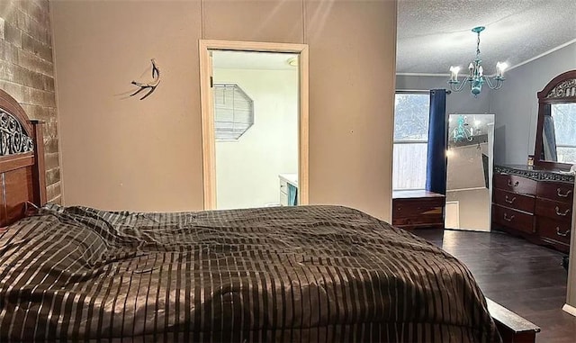 bedroom with multiple windows, crown molding, dark hardwood / wood-style floors, and a textured ceiling