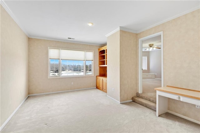 unfurnished bedroom with visible vents, baseboards, light colored carpet, and crown molding