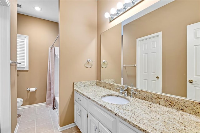 full bathroom featuring vanity, visible vents, baseboards, tile patterned flooring, and toilet