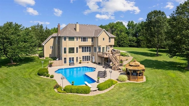 back of house featuring a lawn, a patio, a gazebo, a wooden deck, and stairs