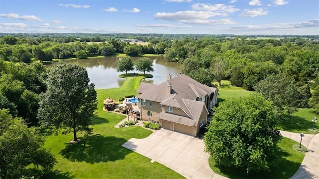 bird's eye view featuring a water view and a view of trees