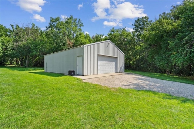 detached garage with gravel driveway