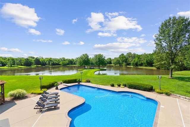 pool featuring a diving board, a water view, a lawn, and a patio