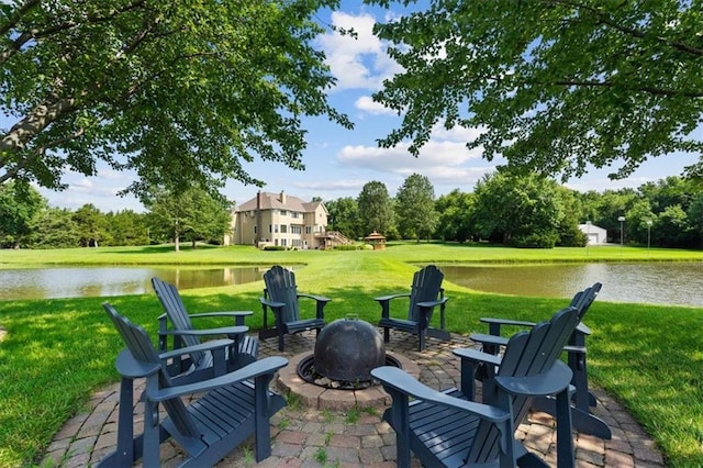 view of patio / terrace featuring a water view and an outdoor fire pit