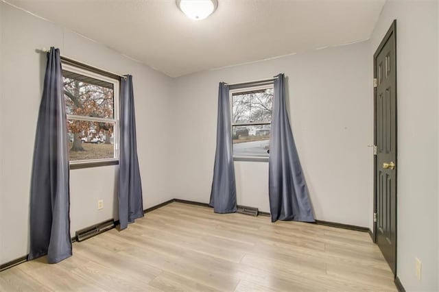 empty room featuring light hardwood / wood-style floors