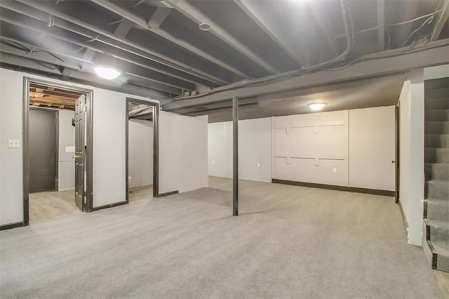 basement with light colored carpet