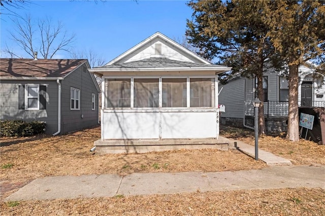 view of front of house featuring a sunroom