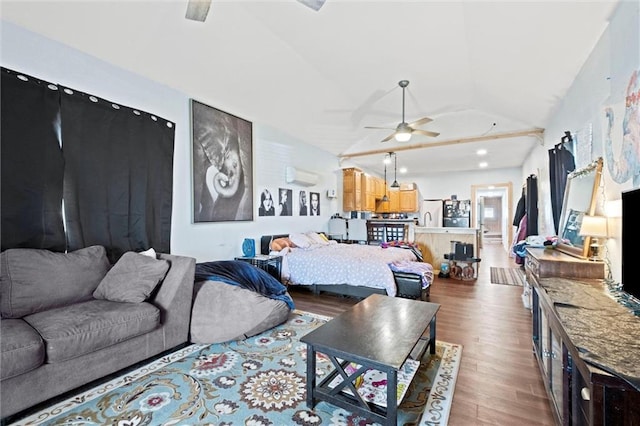 living area with ceiling fan, vaulted ceiling, dark wood-style flooring, and an AC wall unit