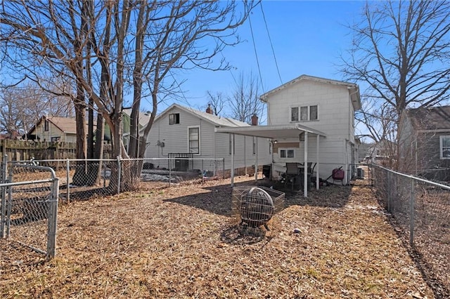 back of property with a fenced backyard