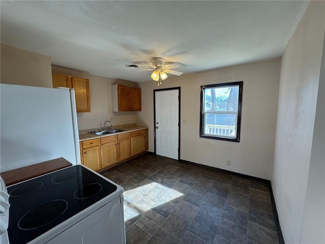 kitchen with ceiling fan, white electric range, refrigerator, and sink