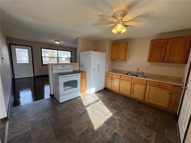 kitchen featuring ceiling fan, white appliances, and sink