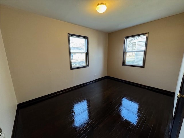 spare room featuring hardwood / wood-style floors