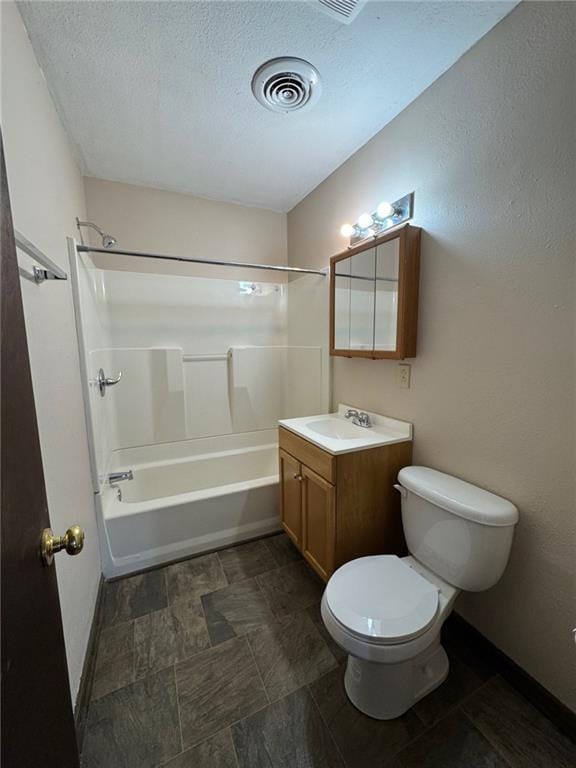 full bathroom with vanity, a textured ceiling, bathing tub / shower combination, and toilet