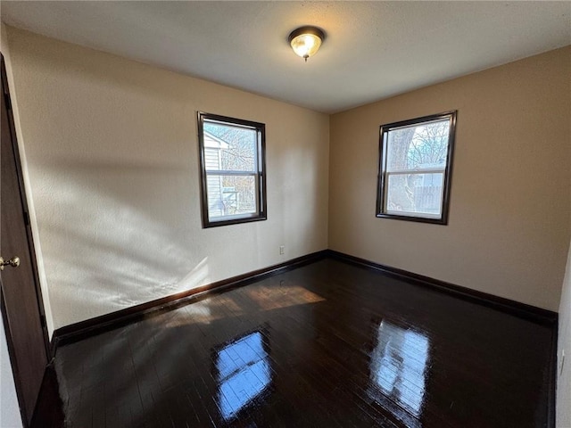 unfurnished room featuring wood-type flooring