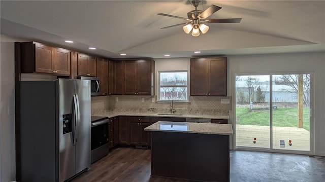 123 NW 171st Rd, Warrensburg, MO 64093 - kitchen featuring appliances with stainless steel finishes, a sink, decorative backsplash, ceiling fan, and lofted ceiling