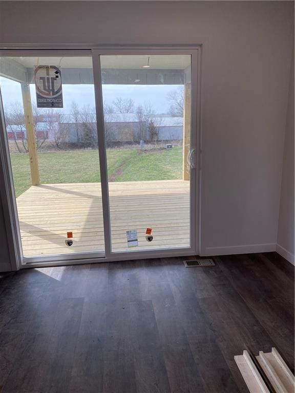 123 NW 171st Rd, Warrensburg, MO 64093 - doorway with dark wood-style floors and baseboards