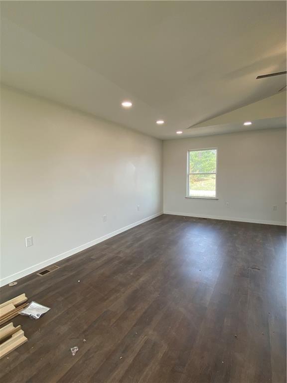 123 NW 171st Rd, Warrensburg, MO 64093 - empty room featuring baseboards, dark wood-style floors, and recessed lighting