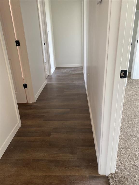 123 NW 171st Rd, Warrensburg, MO 64093 - corridor with dark wood finished floors and baseboards