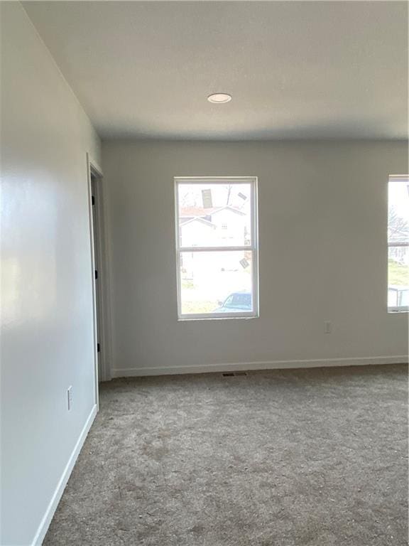123 NW 171st Rd, Warrensburg, MO 64093 - spare room featuring carpet floors, baseboards, and recessed lighting