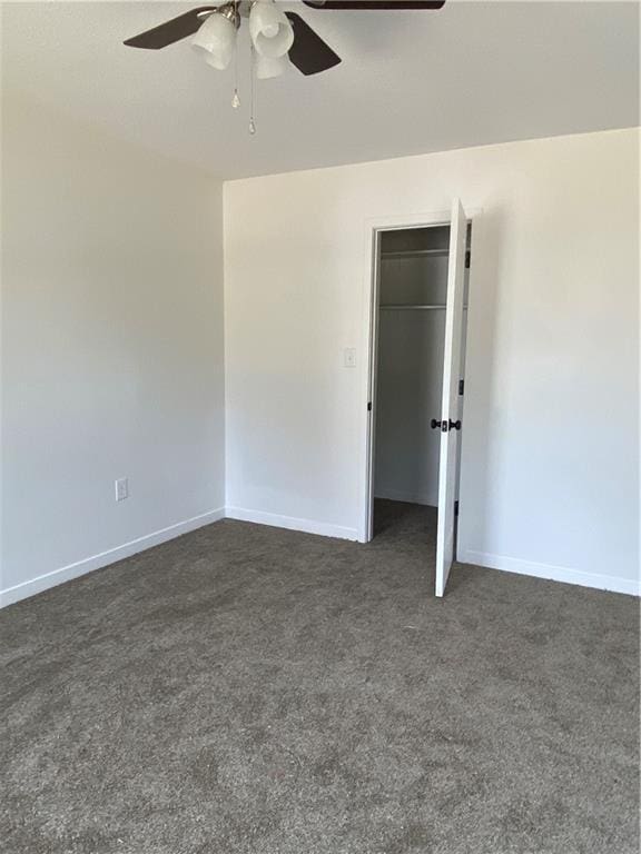 123 NW 171st Rd, Warrensburg, MO 64093 - empty room featuring ceiling fan, dark colored carpet, and baseboards