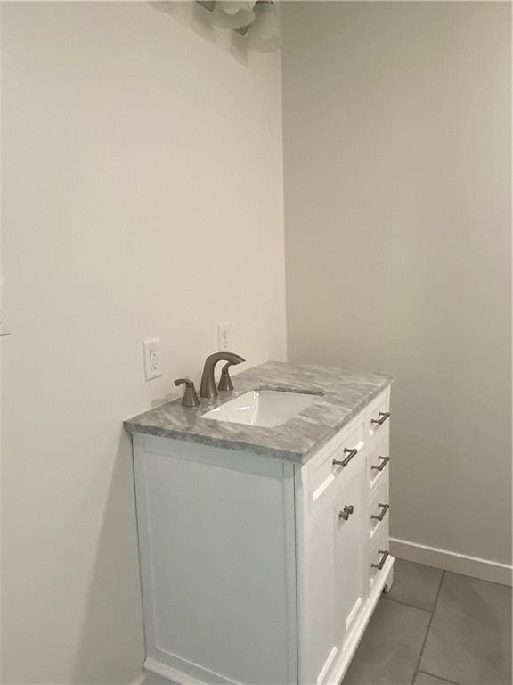 123 NW 171st Rd, Warrensburg, MO 64093 - bathroom featuring tile patterned flooring, vanity, and baseboards