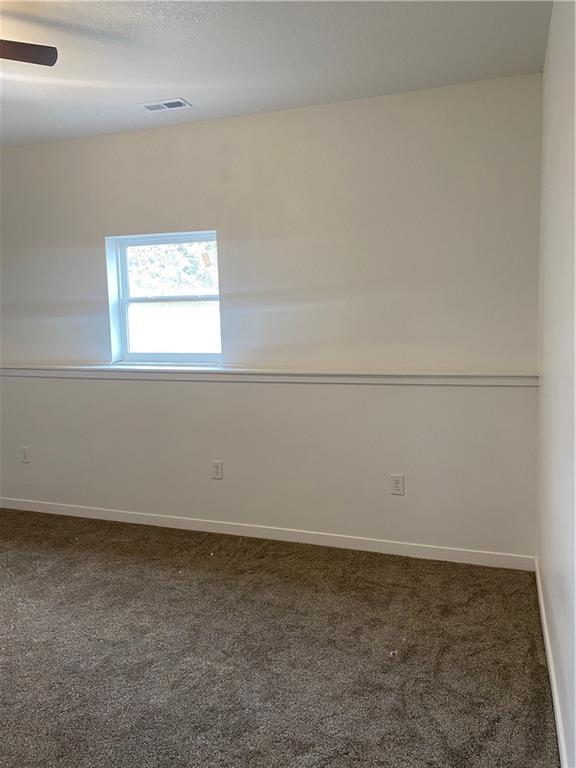 123 NW 171st Rd, Warrensburg, MO 64093 - unfurnished room featuring carpet flooring, baseboards, and ceiling fan
