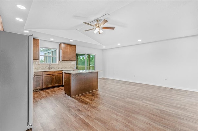 123 NW 171st Rd, Warrensburg, MO 64093 - kitchen with freestanding refrigerator, a ceiling fan, light wood-style floors, a center island, and recessed lighting