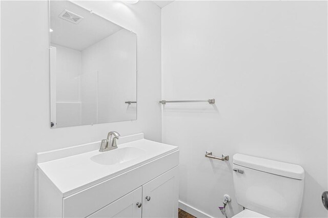 123 NW 171st Rd, Warrensburg, MO 64093 - bathroom with toilet, vanity, and baseboards