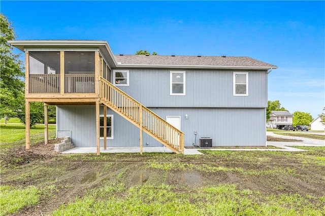 123 NW 171st Rd, Warrensburg, MO 64093 - back of house featuring a sunroom, stairway, a patio area, and central AC