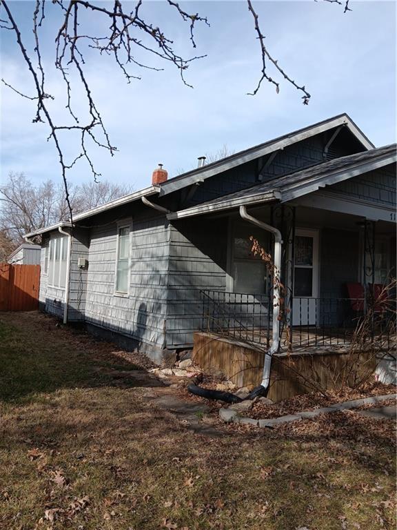 view of home's exterior with a yard