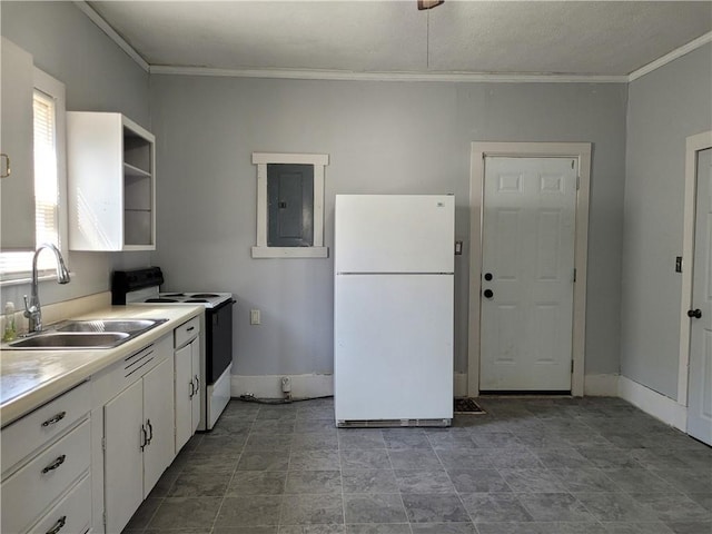 kitchen with electric panel, white cabinets, electric stove, freestanding refrigerator, and a sink