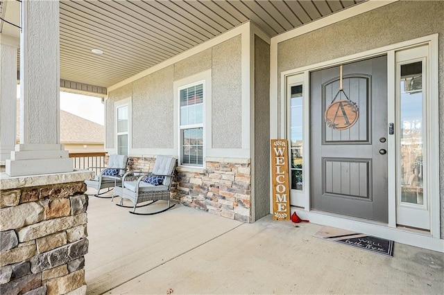 property entrance with covered porch