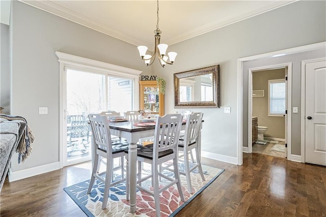 dining room featuring crown molding, a notable chandelier, and dark hardwood / wood-style flooring