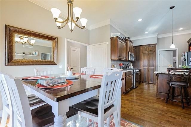 dining space with an inviting chandelier, crown molding, and dark hardwood / wood-style floors