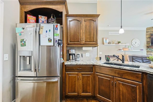 kitchen featuring stainless steel refrigerator with ice dispenser, sink, ornamental molding, black dishwasher, and backsplash