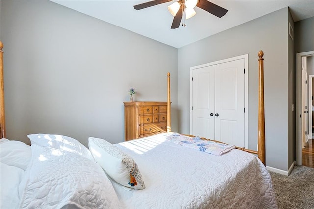 carpeted bedroom featuring a closet and ceiling fan