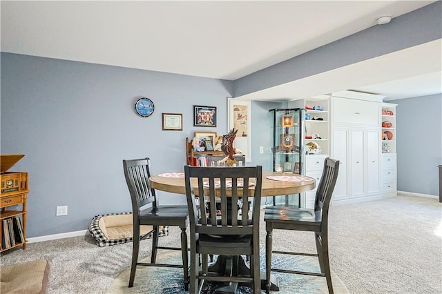 dining space featuring carpet floors