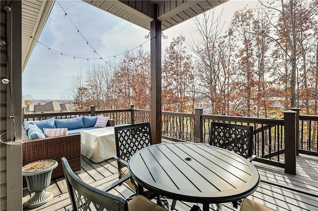 wooden terrace with outdoor lounge area