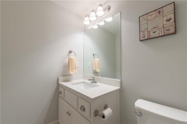 bathroom with toilet and vanity