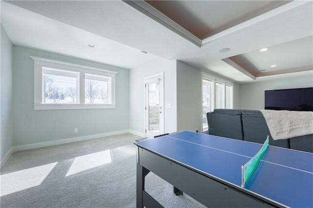 recreation room featuring visible vents, baseboards, carpet, a tray ceiling, and recessed lighting