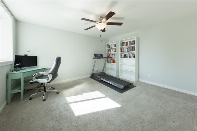 office with carpet, a ceiling fan, and baseboards