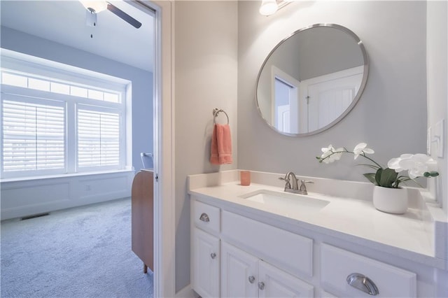 bathroom with vanity and visible vents