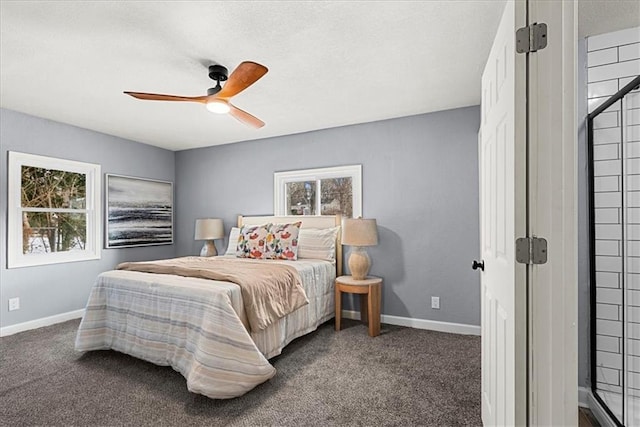 bedroom with ceiling fan and dark colored carpet