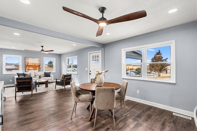 dining room featuring dark wood-type flooring and ceiling fan