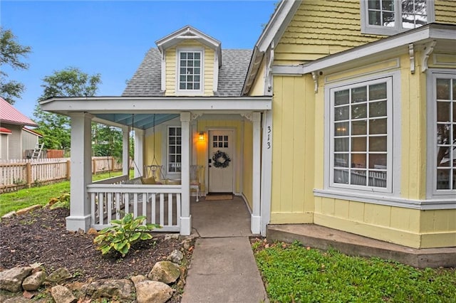 property entrance with covered porch