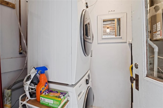 laundry area with stacked washer and clothes dryer